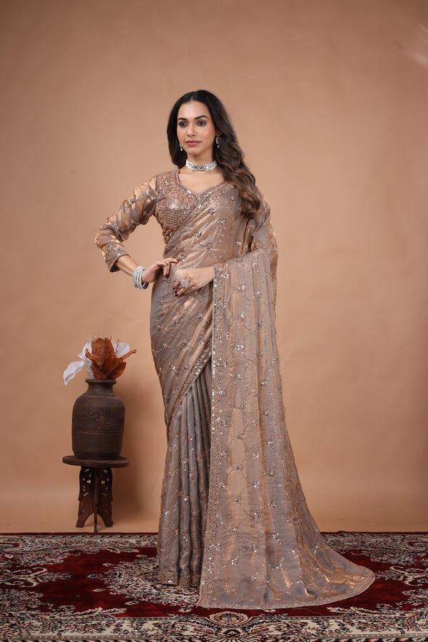 Elegant silk saree with rose gold cutdana work from Kanyaari, showcasing intricate gold embroidery and luxurious fabric details.