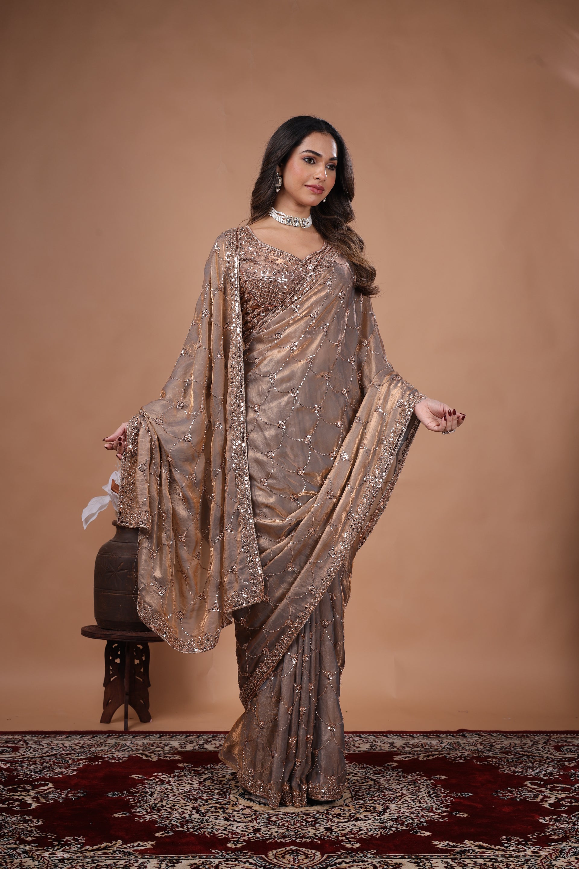 Elegant silk saree with rose gold cutdana work, showcasing intricate gold embroidery and luxurious fabric by Kanyaari.