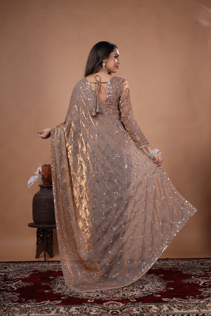 Elegant silk saree with rose gold cutdana work by Kanyaari, featuring intricate gold embroidery and luxurious fabric.