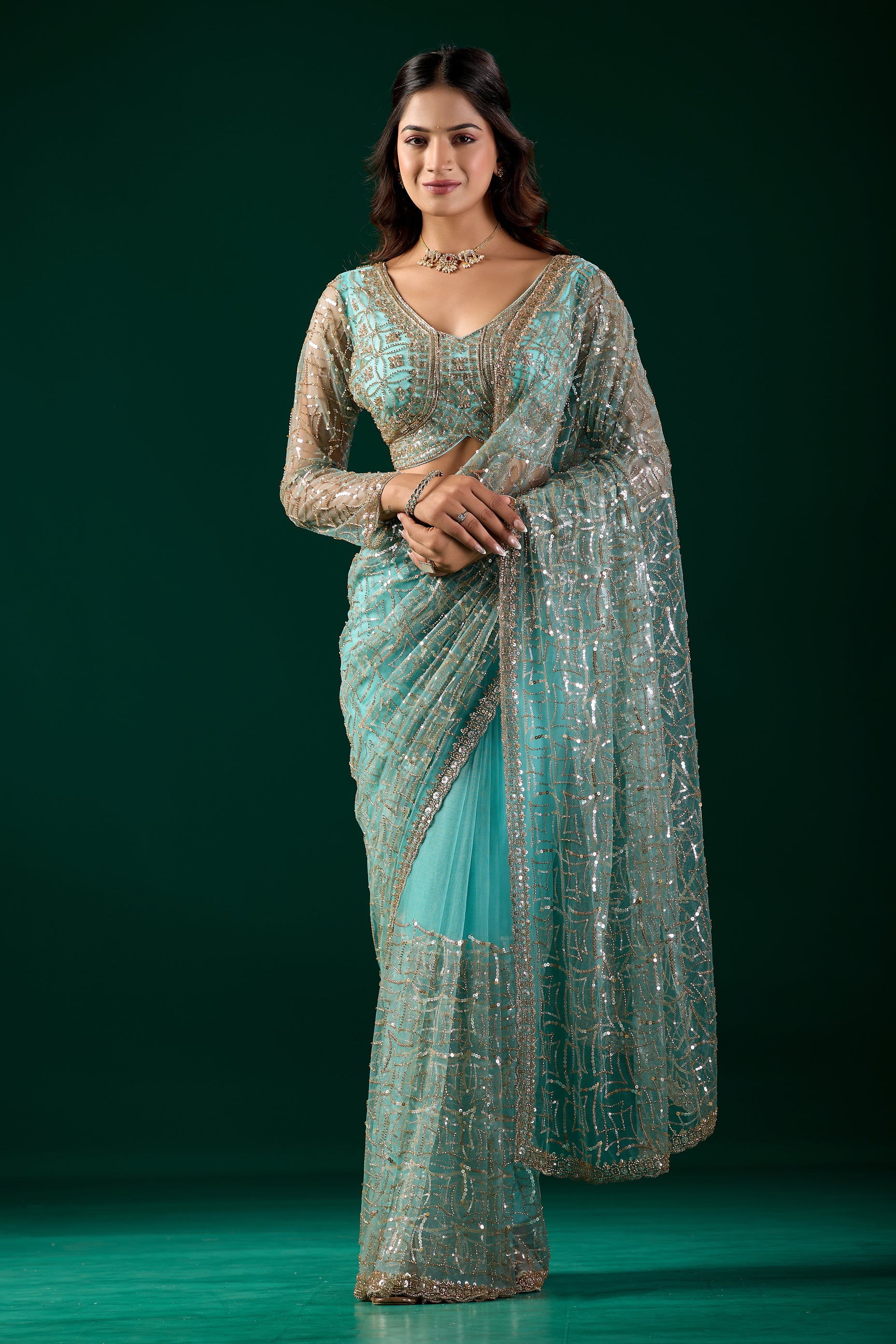 Kanyaari blue saree with heavy cutdana embroidery and net fabric, featuring intricate design and traditional craftsmanship.