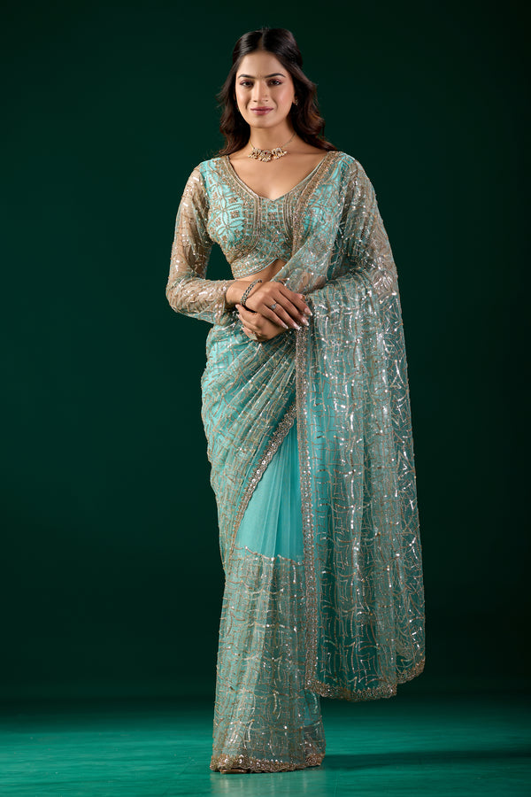 Kanyaari blue saree with heavy cutdana embroidery and net fabric, featuring intricate design and traditional craftsmanship.