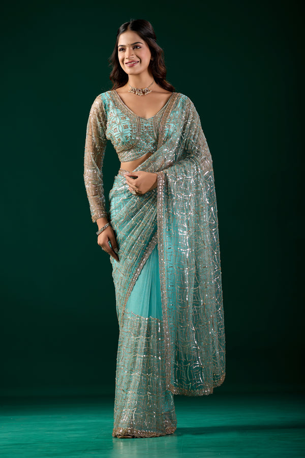 Blue Kanyaari saree with heavy cutdana embroidery and net fabric, featuring intricate design and elegant drape.