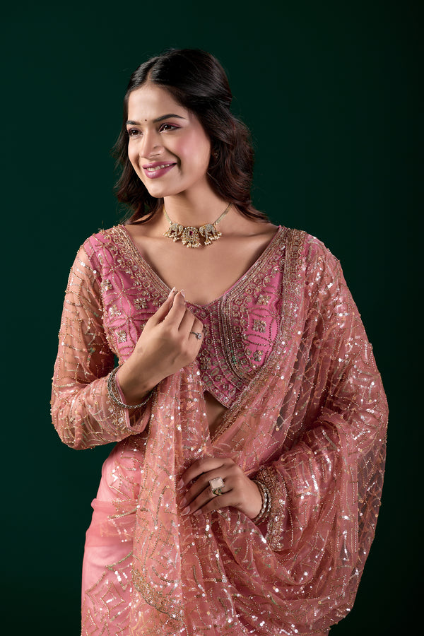 Pink embroidered saree by Kanyaari featuring heavy cutdana embroidery and net fabric, worn by model in traditional styling.