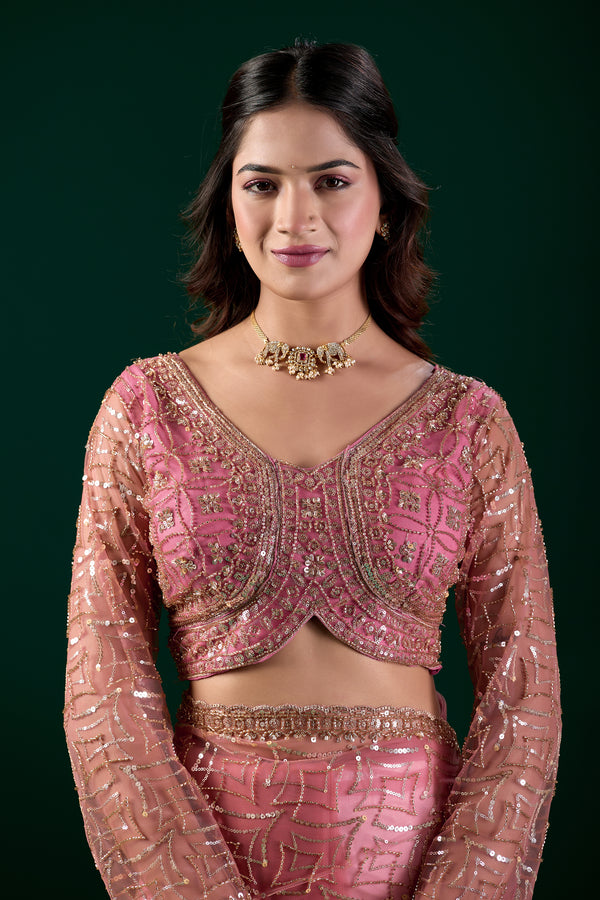 Pink embroidered saree with heavy cutdana work by Kanyaari, featuring intricate net fabric and traditional design.