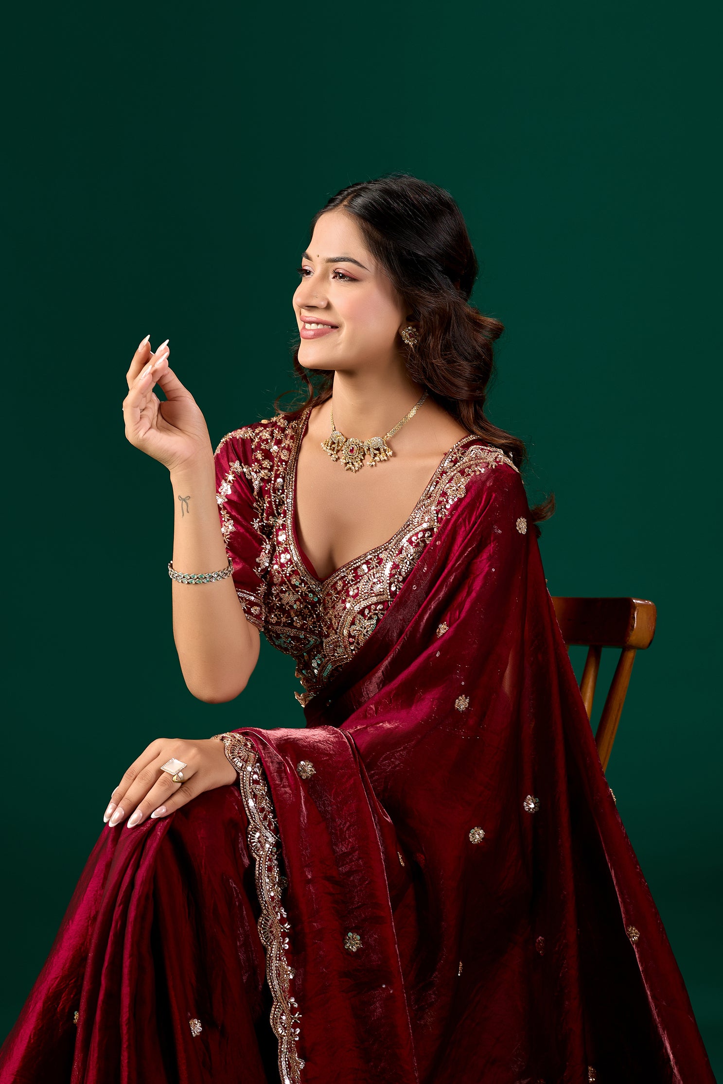 Maroon saree with intricate cutdana work from Kanyaari Nora collection, showcasing elegant fabric and detailed embellishments.