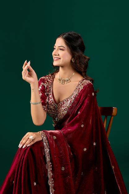 Maroon saree with intricate cutdana work from Kanyaari Nora collection, showcasing elegant fabric and detailed embellishments.