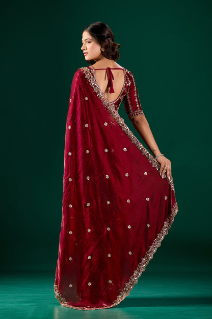 Maroon saree with detailed cutdana work from Kanyaari, showcasing intricate embroidery and elegant drape in the Full Heavy Nora saree.