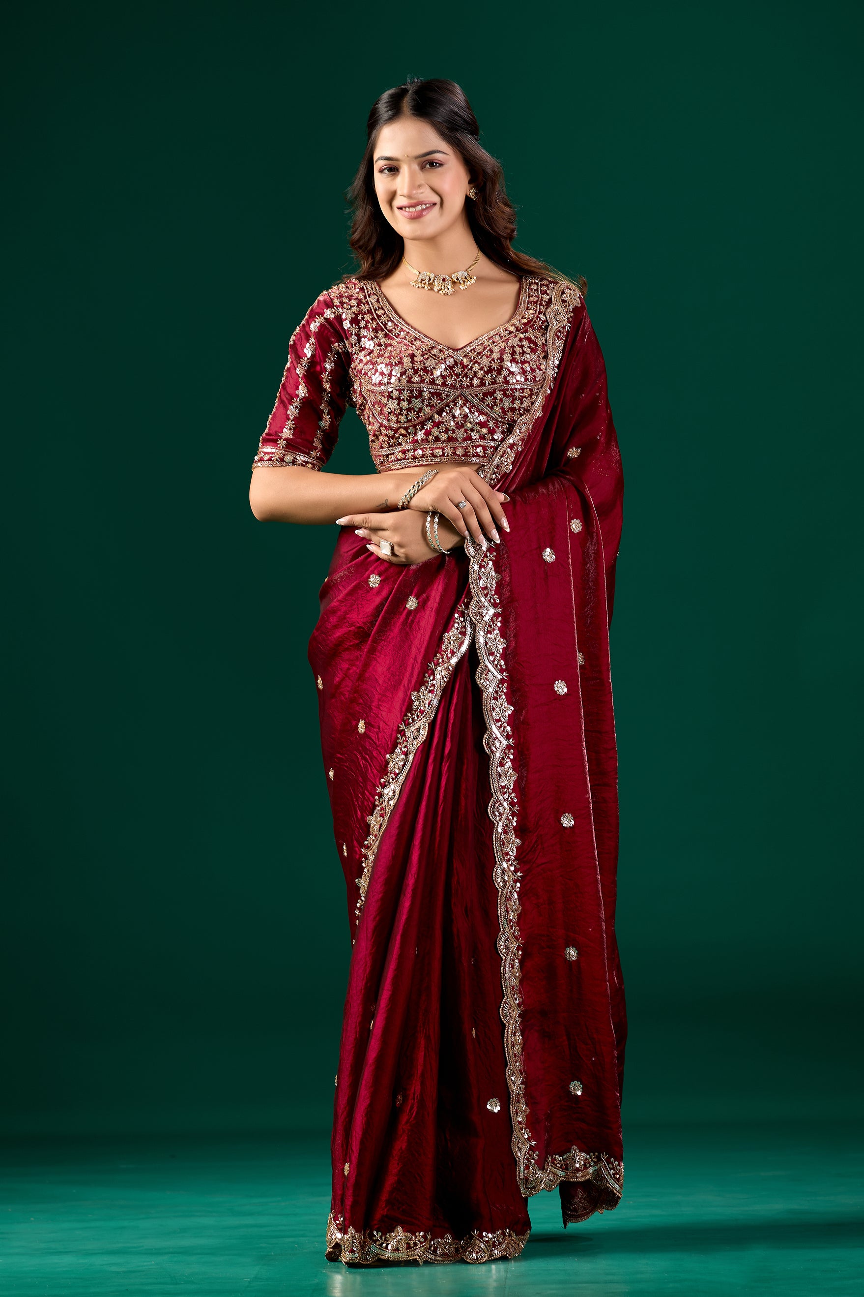 Maroon full heavy saree with intricate cutdana work by Kanyaari, featuring detailed embroidery and traditional drape.
