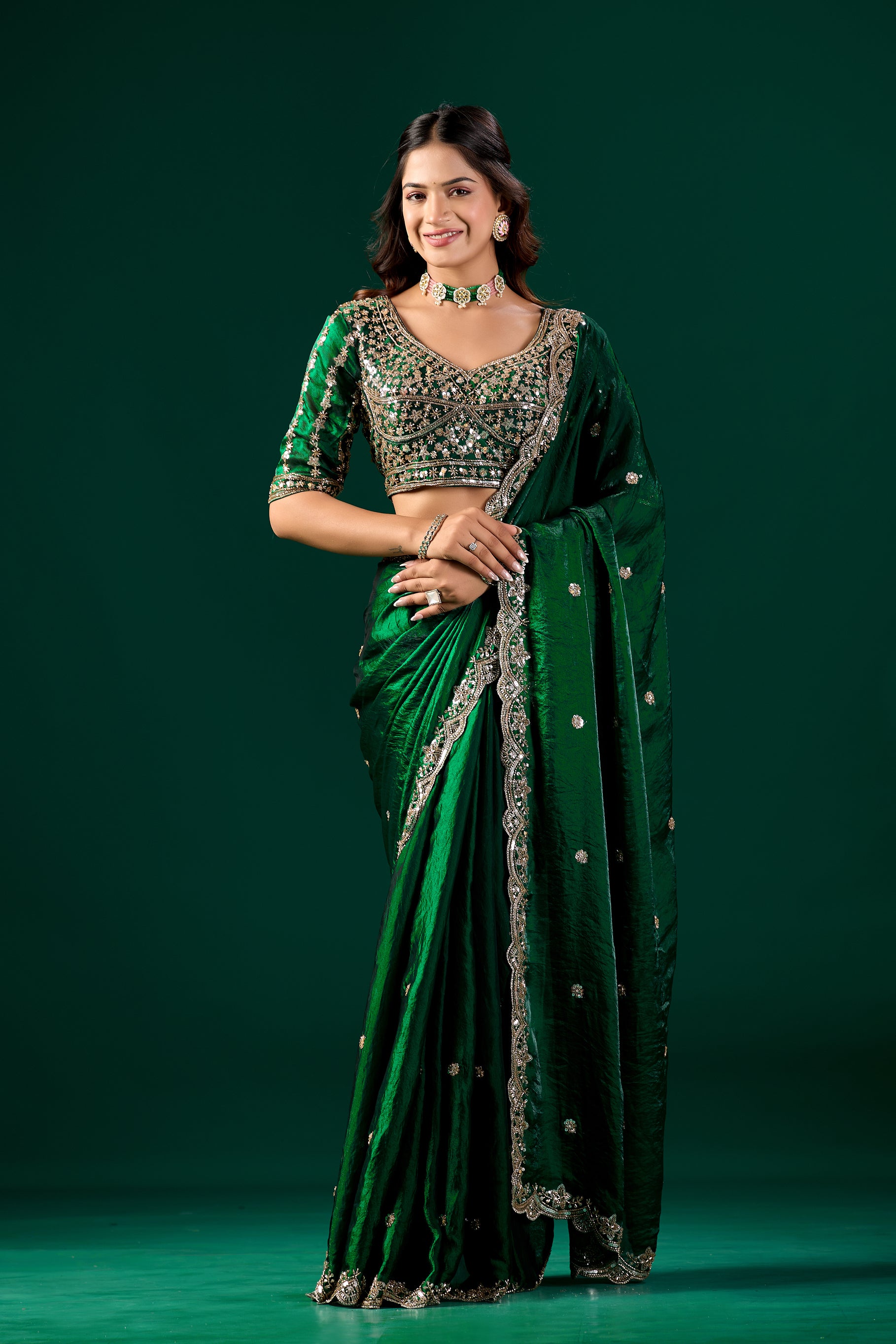 Full heavy green saree with intricate cutdana work from Kanyaari, showcasing detailed embroidery and traditional fabric.