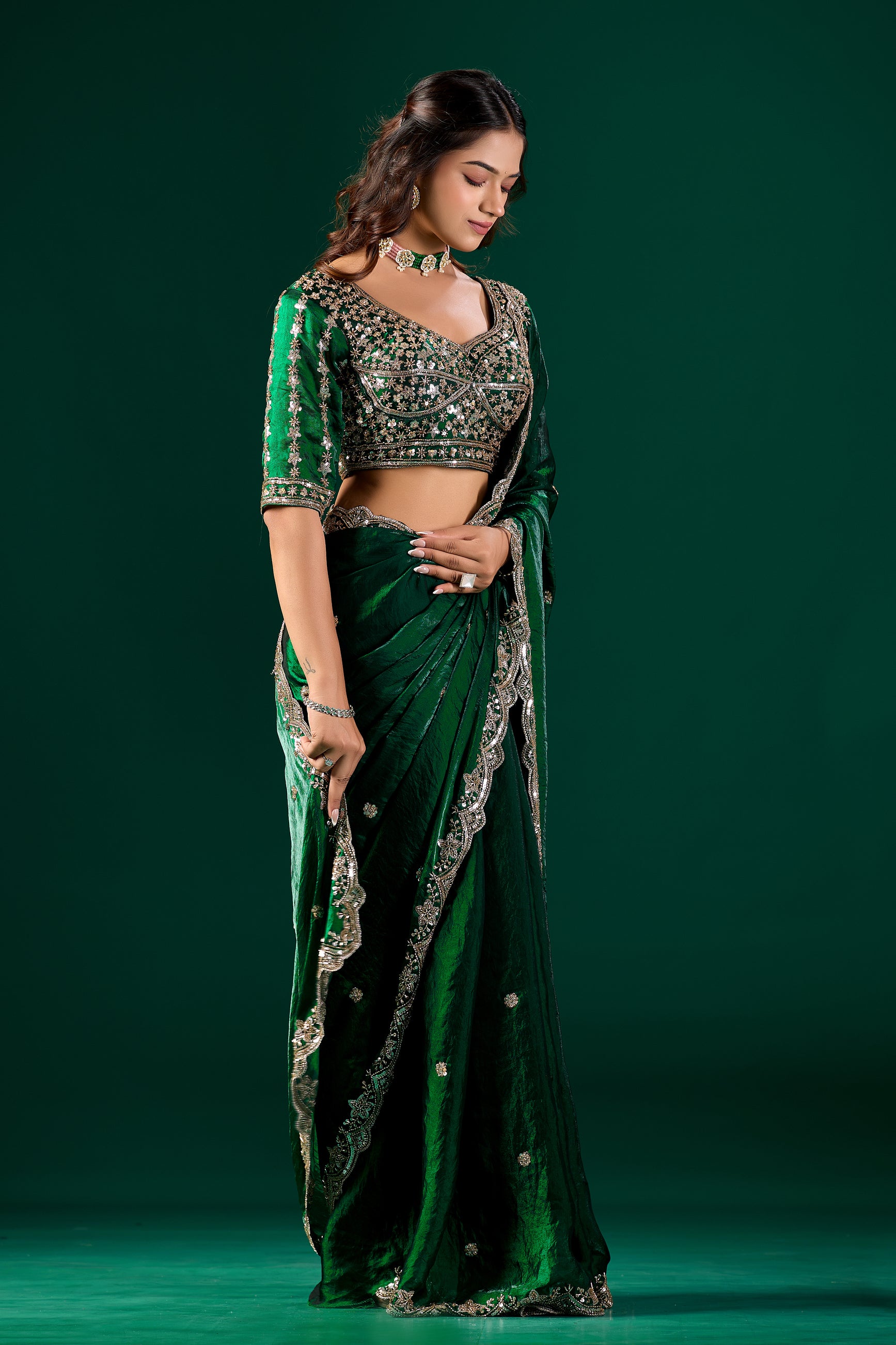 Green saree with cutdana work by Kanyaari, featuring intricate embroidery and elegant drape, shown in NoraGreen_3.jpg.