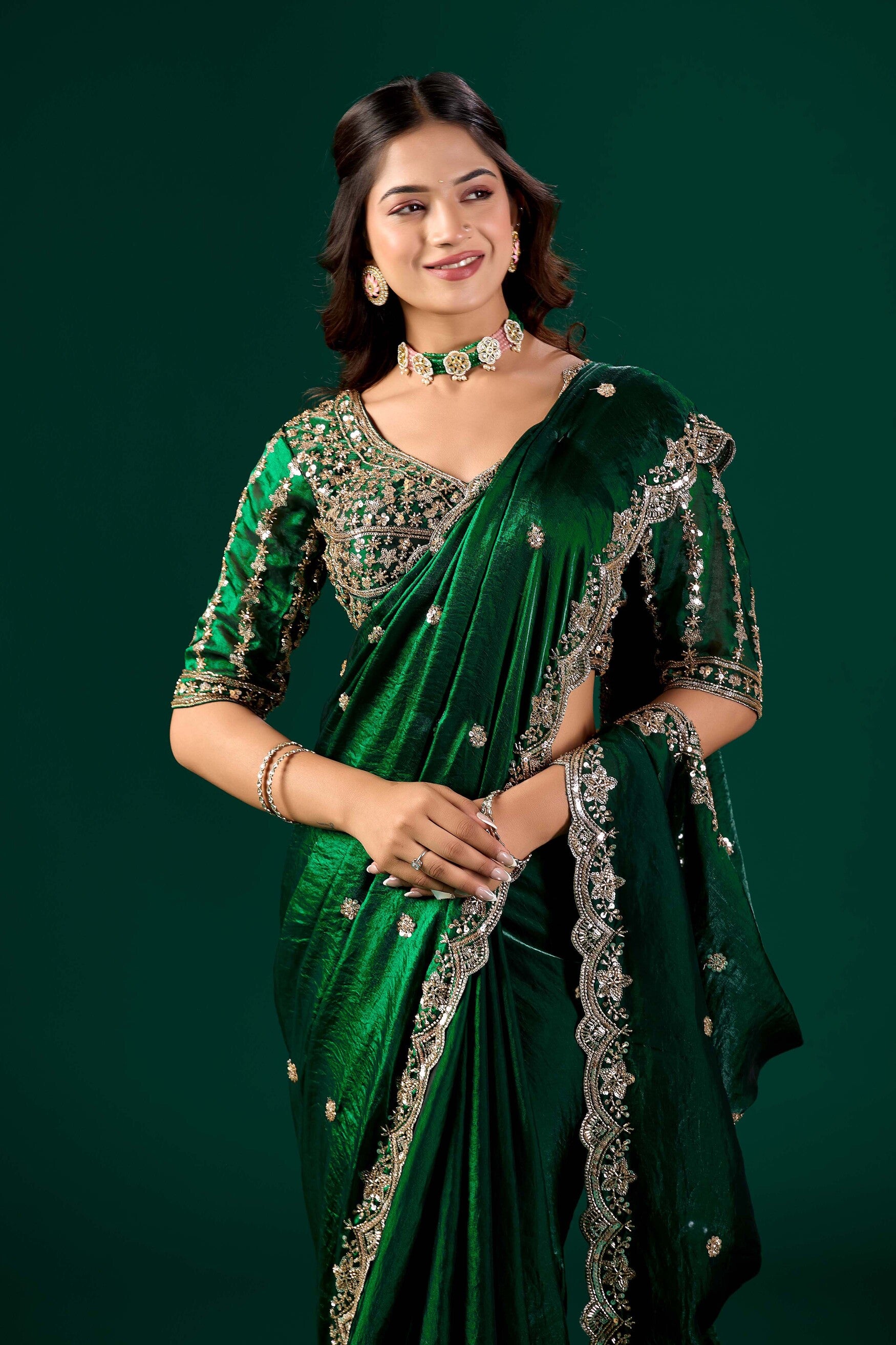 Heavy green saree with intricate cutdana work by Kanyaari, featuring detailed embroidery and traditional design.