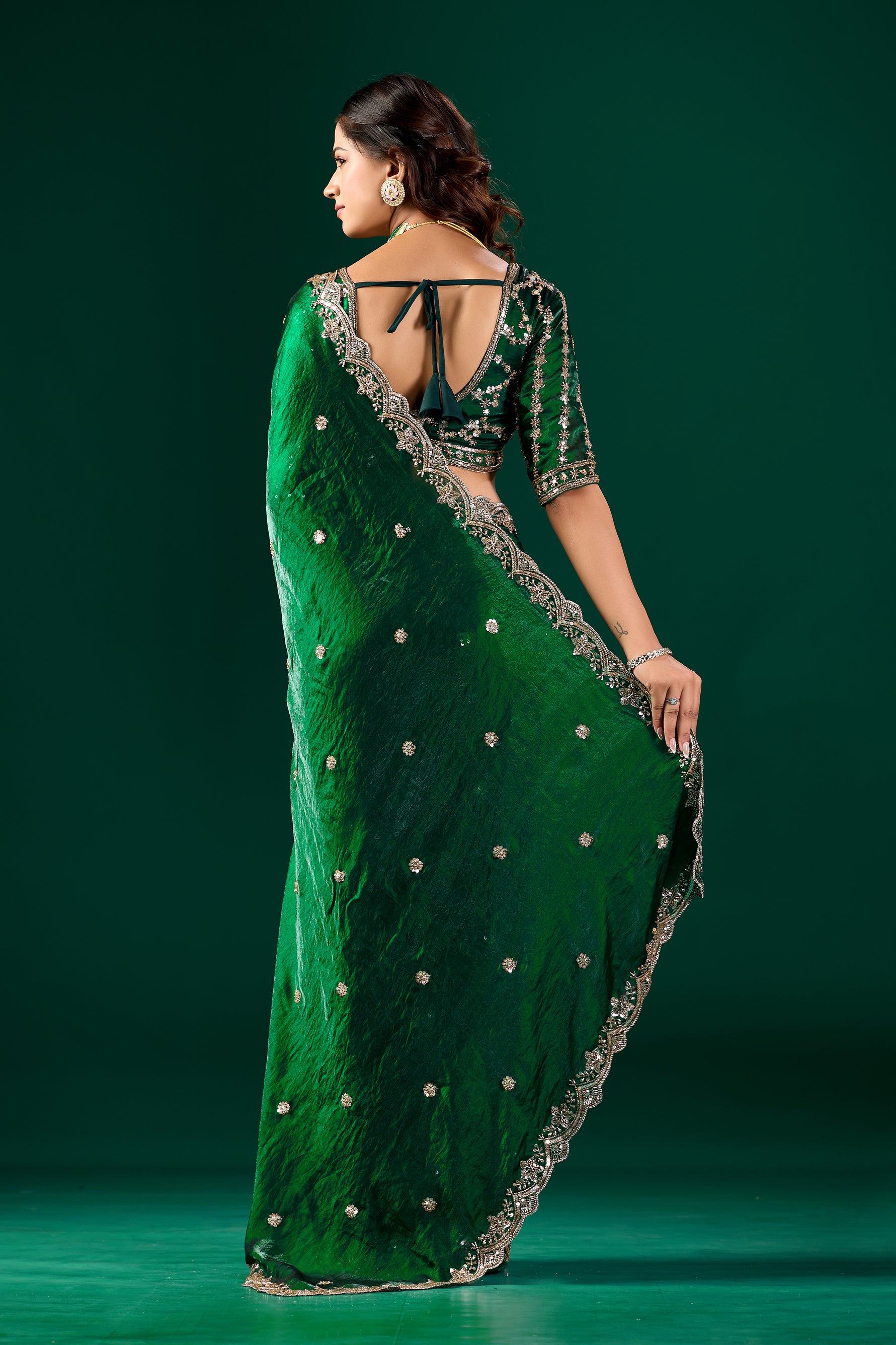 Green Kanyaari saree with intricate cutdana work, featuring a full heavy design and elegant drape.