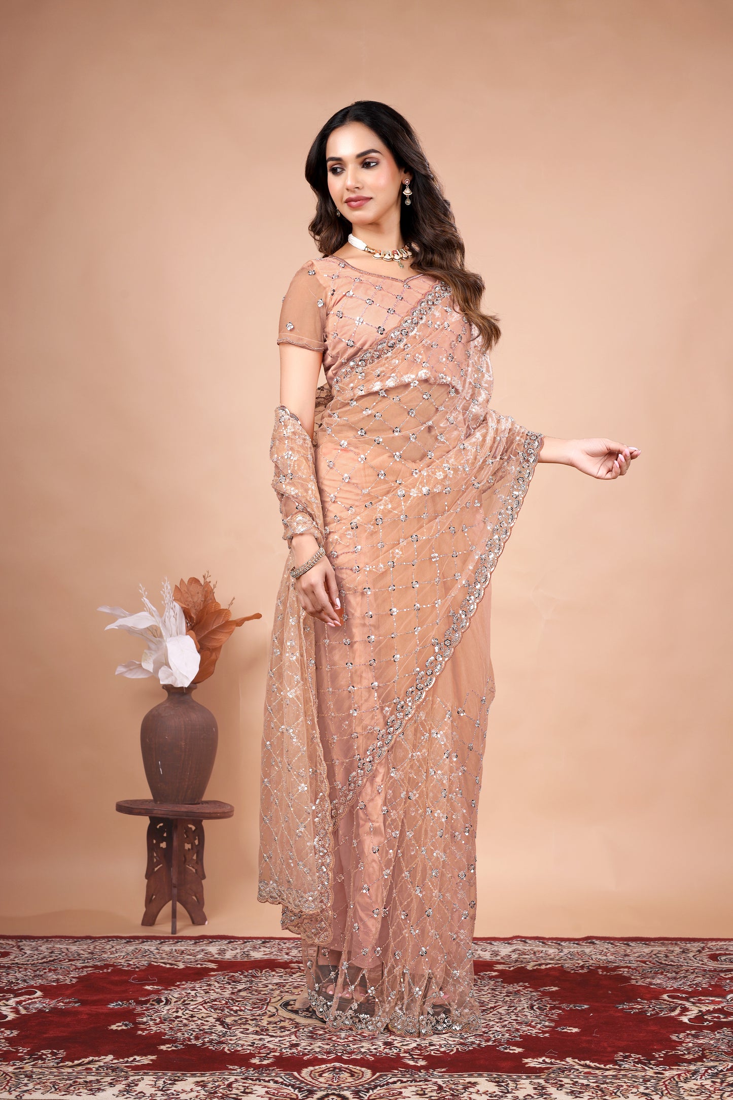 Cross Stylish Orange Net saree with Cutdana Work