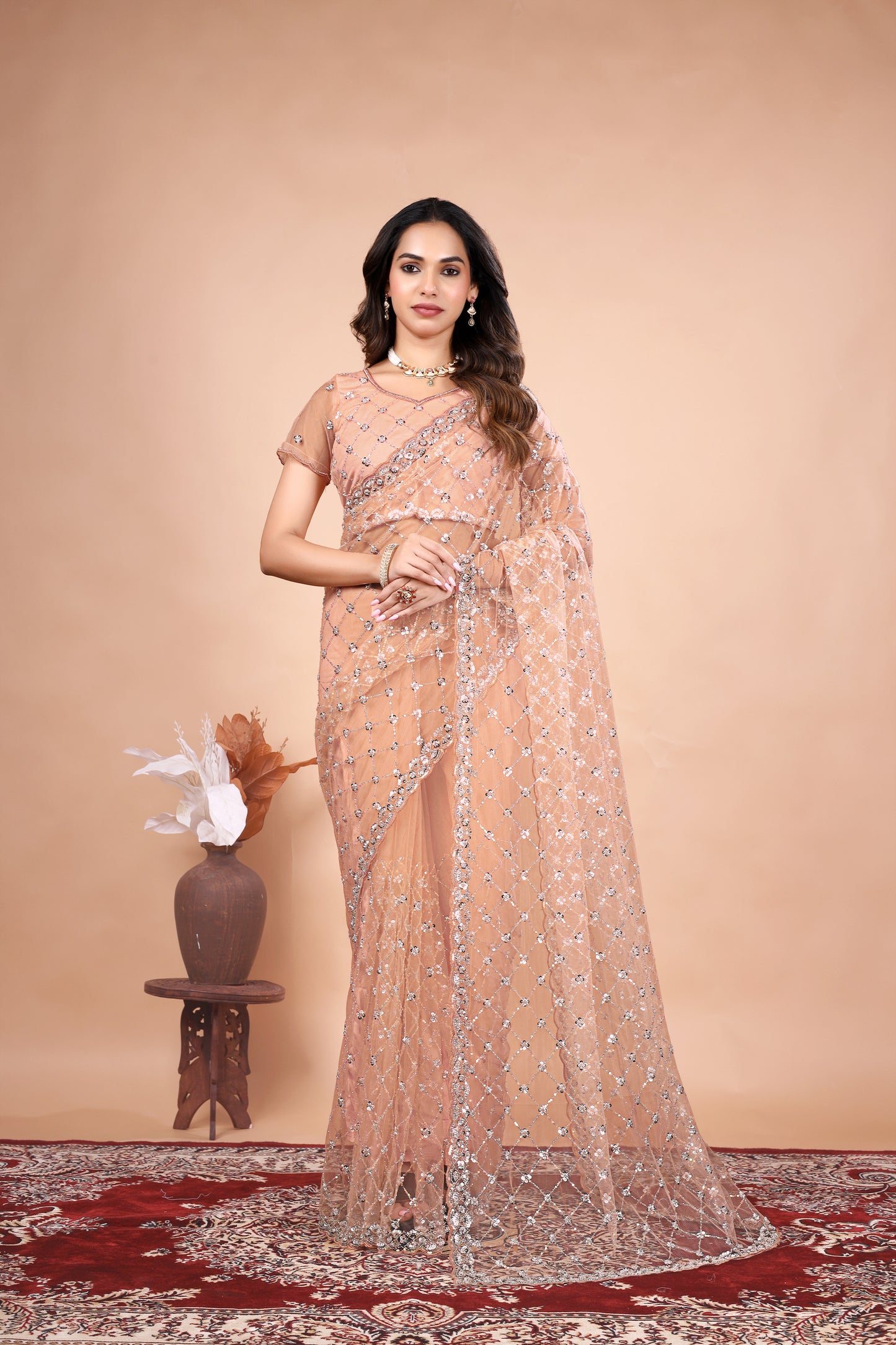 Cross Stylish Orange Net saree with Cutdana Work