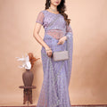 Cross Stylish Green Net saree with Cutdana Work