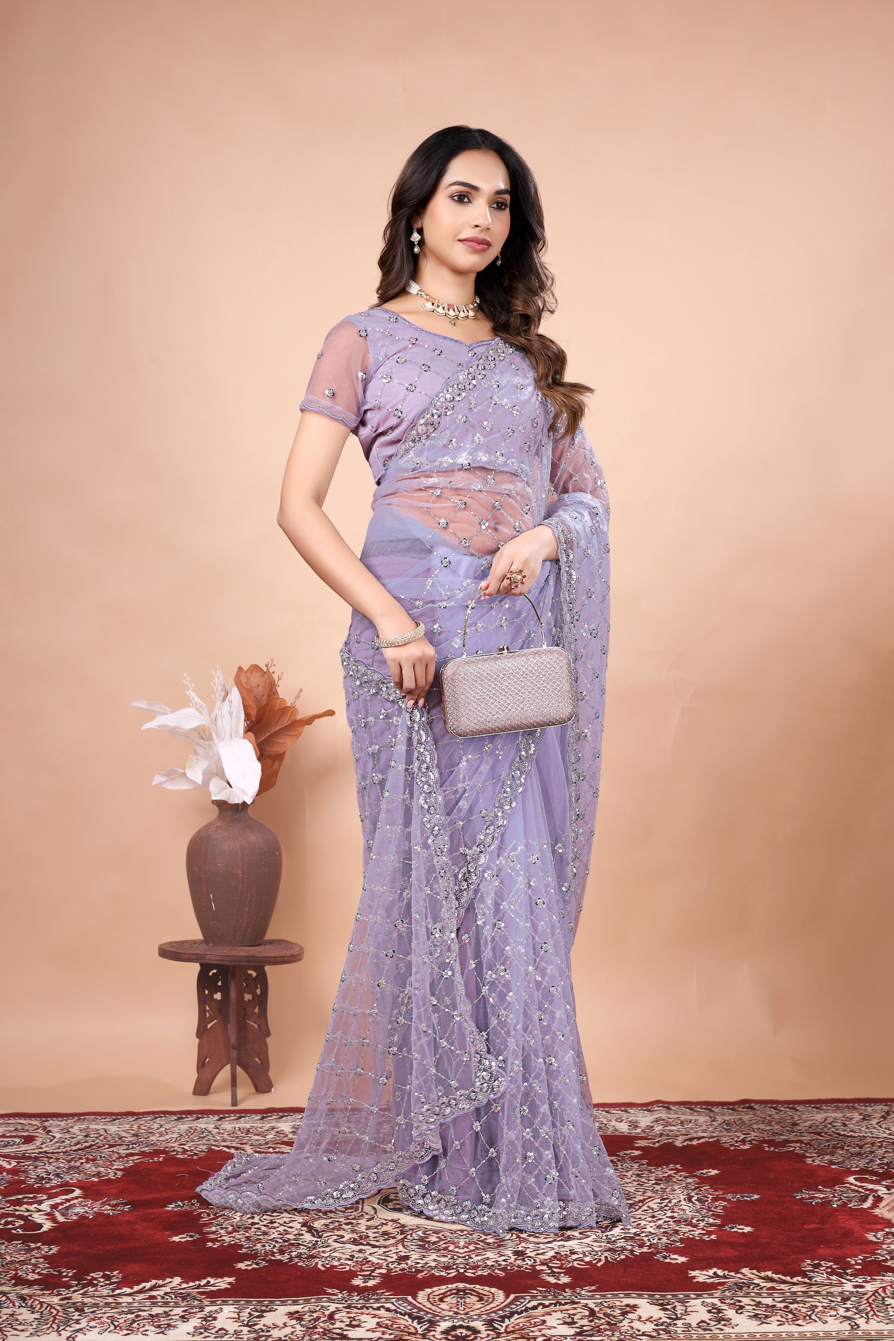 Green net saree with cutdana work by Kanyaari, featuring stylish design and intricate detailing on the fabric.