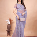 Cross Stylish Green Net saree with Cutdana Work