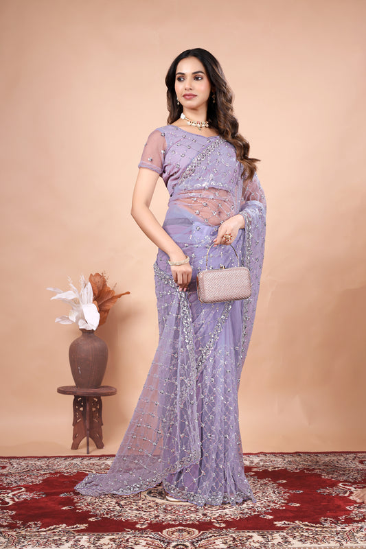 Elegant green net saree with cutdana work by Kanyaari, featuring intricate designs and a stylish drape, shown in purpleX_3.jpg.