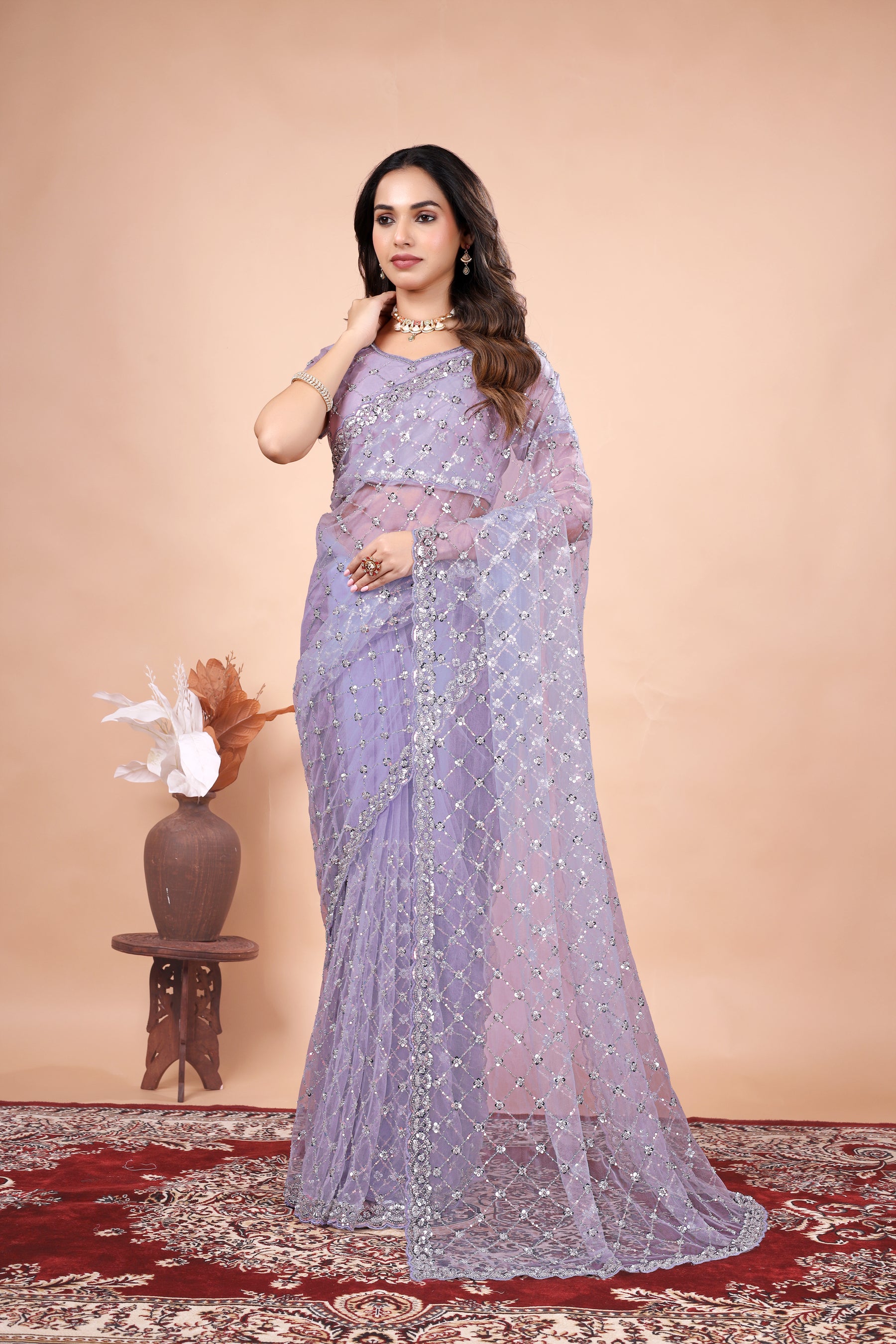 Green net saree with cutdana work by Kanyaari, featuring stylish design and intricate embroidery.