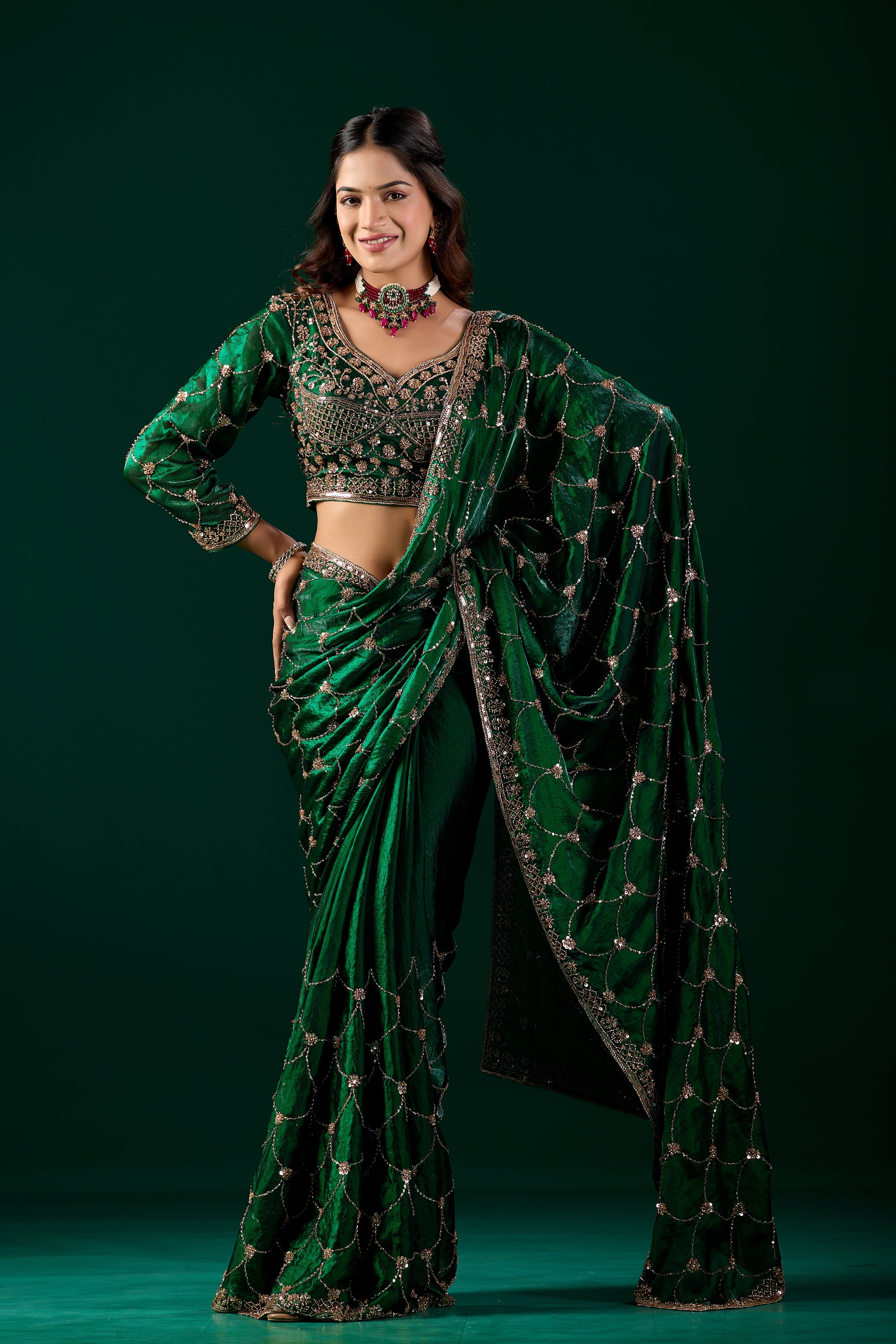 Green silk saree with rose gold cutdana work, luxurious traditional Indian attire by Kanyaari, worn by Rashmika.