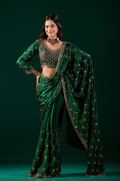 Green silk saree with rose gold cutdana work, luxurious traditional Indian attire by Kanyaari, worn by Rashmika.