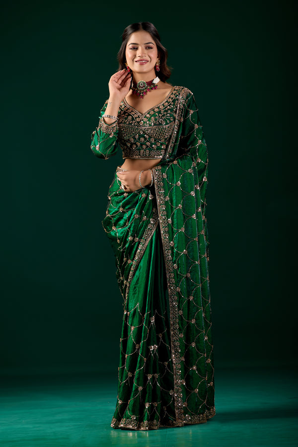 Green silk saree with rose gold cutdana work by Kanyaari, featuring intricate embroidery and luxurious fabric.