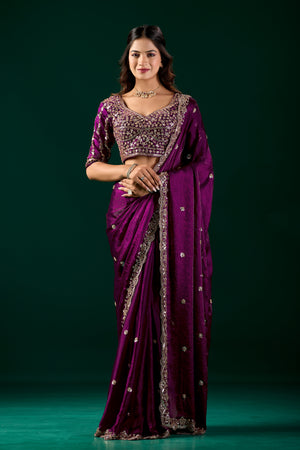 Elegant wine-colored saree with heavy fabric and intricate cutdana work by Kanyaari, showcasing traditional craftsmanship.