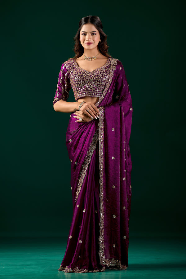 Elegant wine-colored saree with heavy fabric and intricate cutdana work by Kanyaari, showcasing traditional craftsmanship.