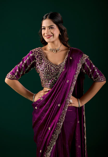 Elegant wine-colored saree with heavy cutdana work, designed by Kanyaari, featuring intricate detailing and traditional craftsmanship.