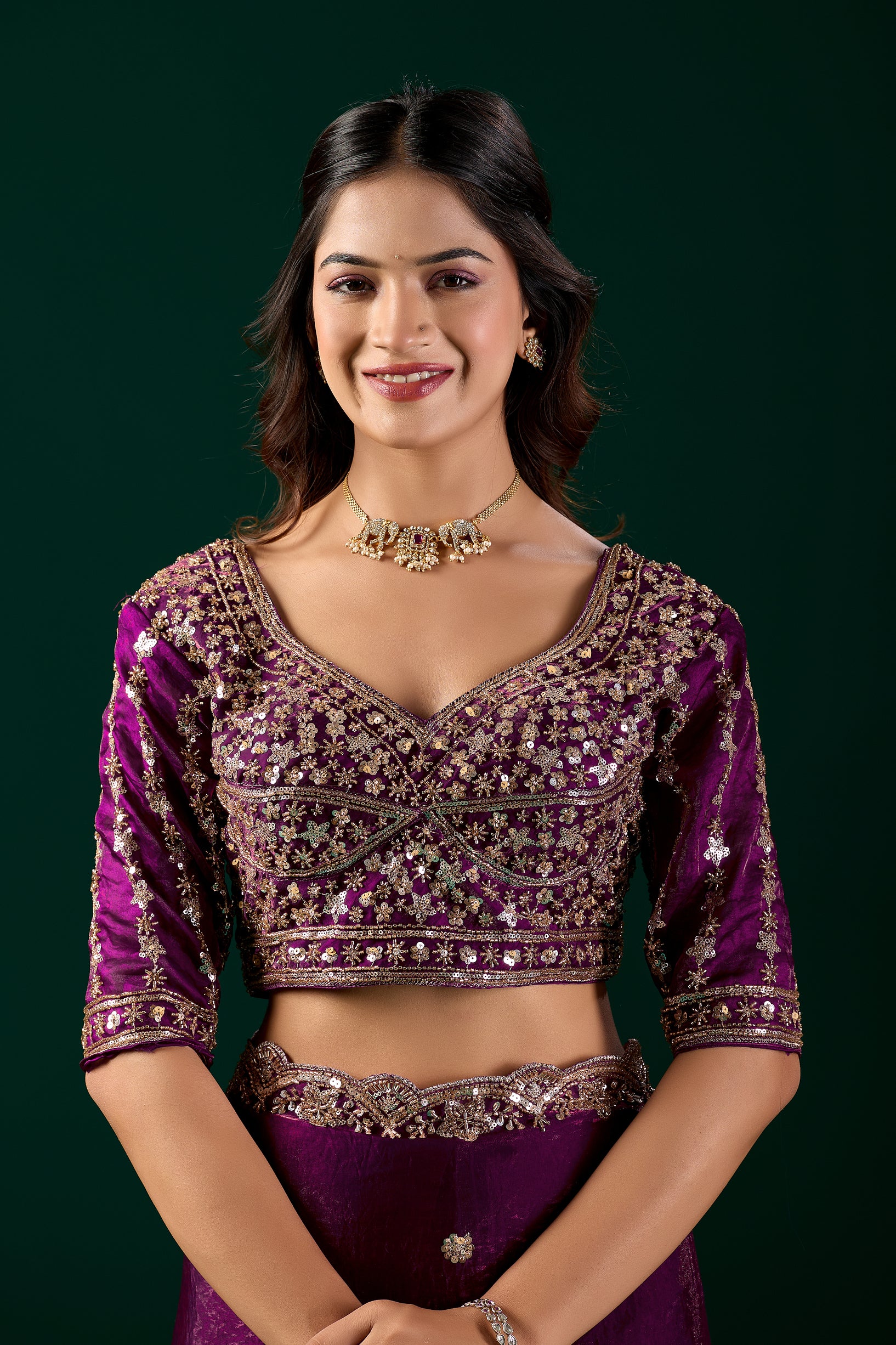 Wine-colored Kanyaari heavy saree with intricate cutdana work, featuring elegant traditional design.