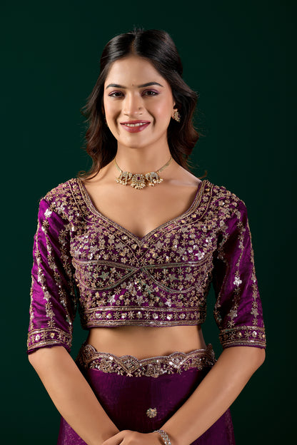 Wine-colored Kanyaari heavy saree with intricate cutdana work, featuring elegant traditional design.
